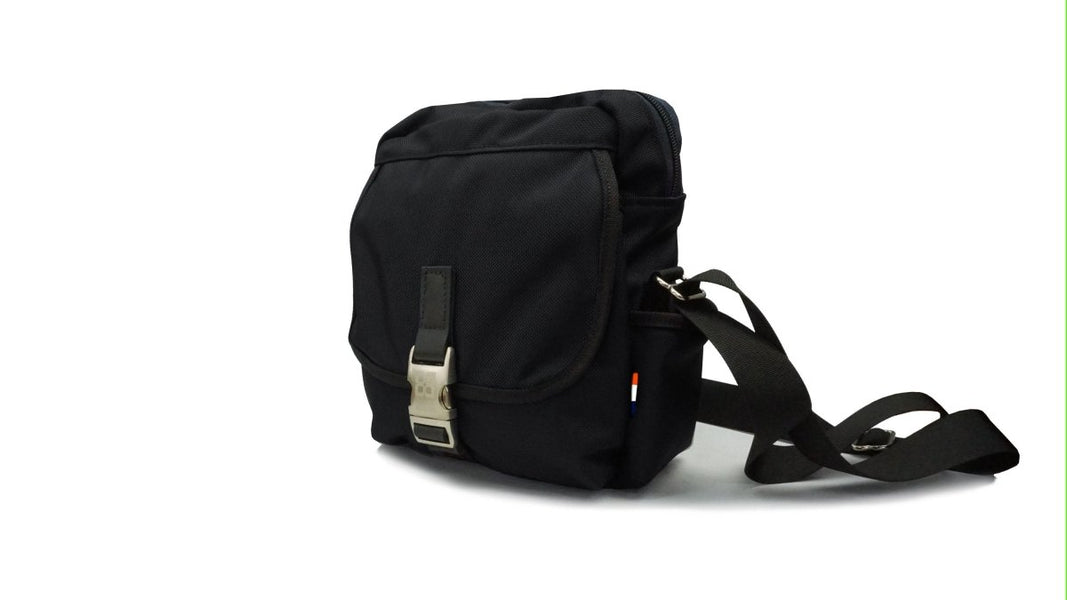 Mini Messenger Bag with leather trim and a lifetime warranty. Tucker