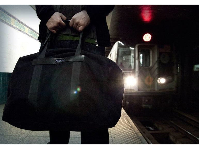 Canvas London Duffel Bag with leather trim and a lifetime warranty